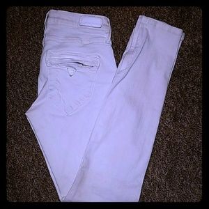 Distressed white jeans